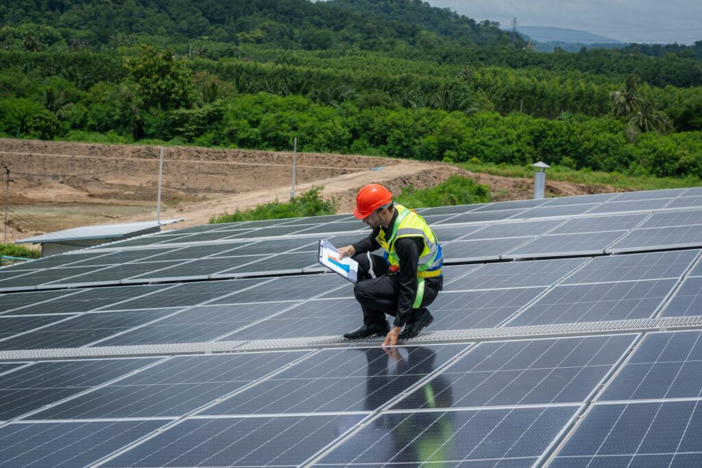 Technician installing the solar panels at roof top,Technician checking Solar panel.